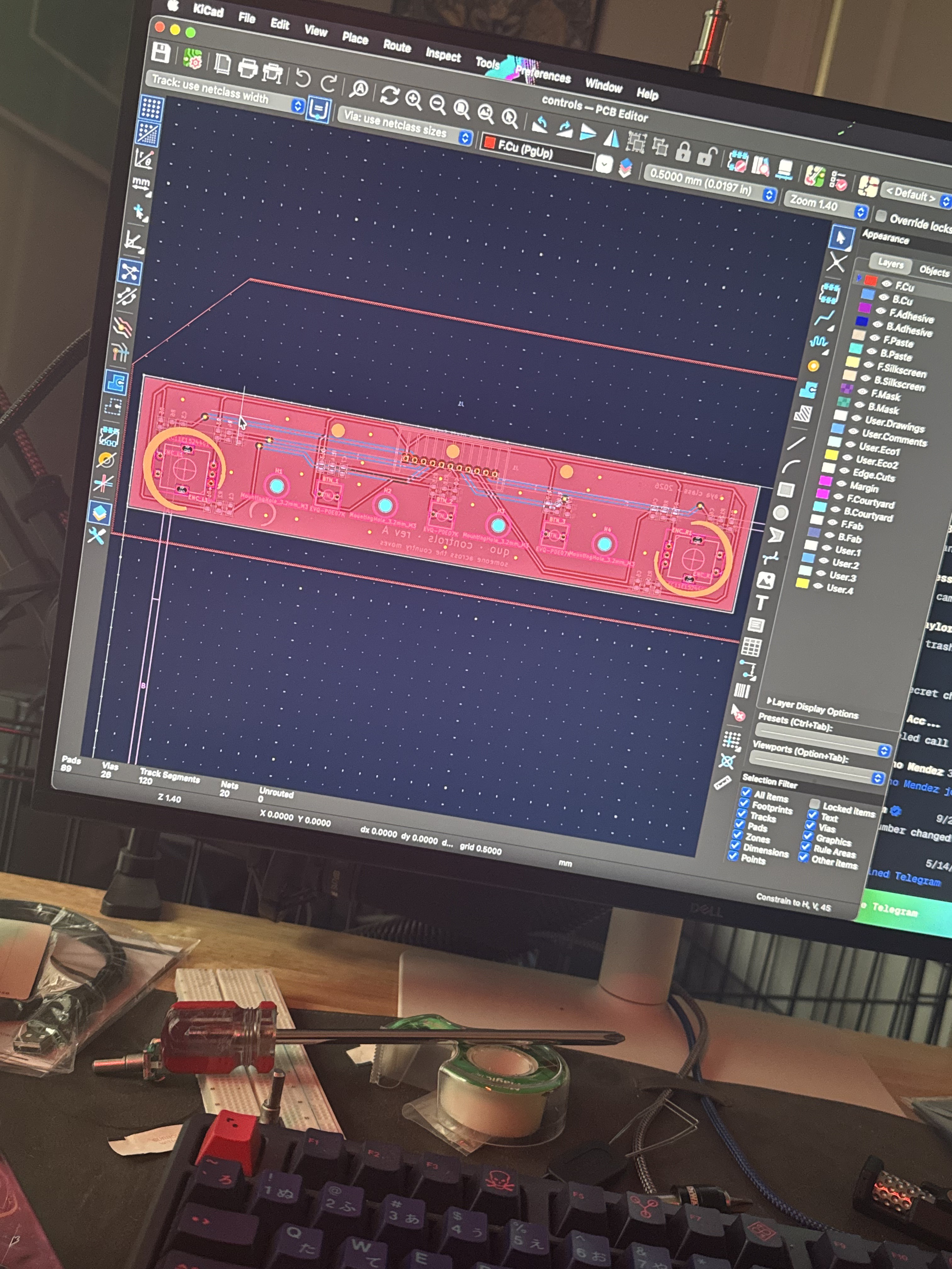 The controls board in KiCad, with an enso around each knob